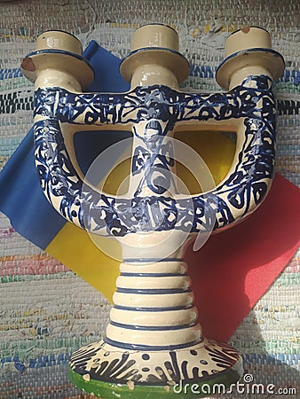Handmade traditional Romanian objects placed on the Romanian flag and on a handmade carpet during the loom Stock Photo